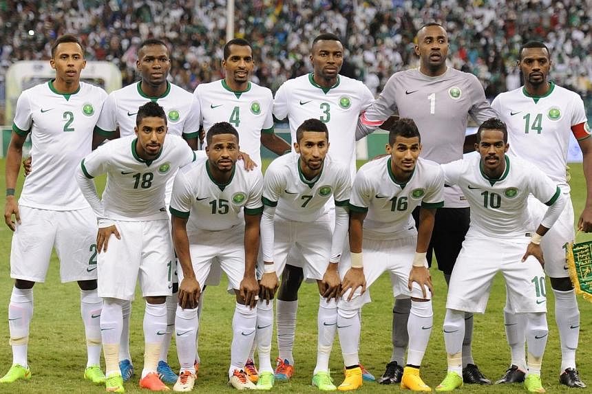 Saudi Arabia's starting eleven pose for a group picture ahead of the final of the 22nd Gulf Cup football match against Qatar at the King Fahad stadium in Riyadh, on Nov 26, 2014.&nbsp;Saudi Arabia's Asian Cup coach Cosmin Olaroiu has warned there was