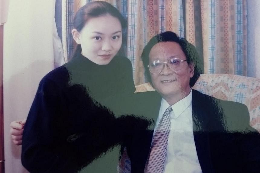 With her father, composer and violinist Qian Zhaoxi, in 2005.&nbsp;-- PHOTO: COURTESY OF QIAN ZHOU