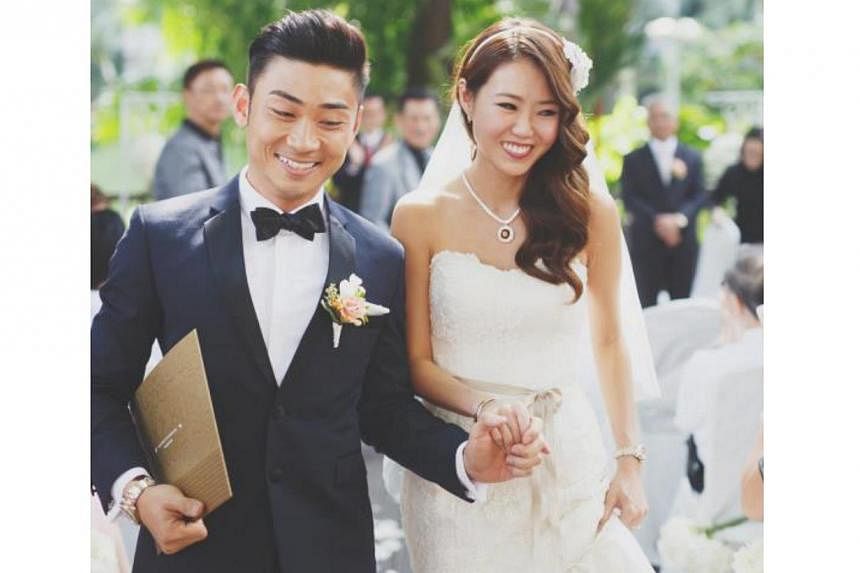 Singers Tay Kewei and Alfred Sim at their wedding.&nbsp;-- PHOTO:&nbsp;YU HSIN FROM TINYDOT PHOTOGRAPHY/ S2S PTE LTD