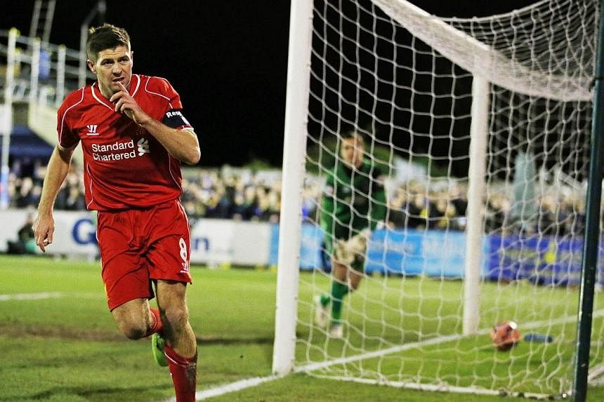 Liverpool's Steven Gerrard celebrates scoring his first goal against Wimbledon during&nbsp;a FA Cup third round football match at the Cherry Red Records Fans Stadium, Kingsmeadow on Jan 5, 2015. -- PHOTO: ACTION IMAGES