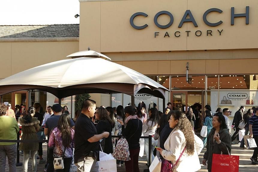 People waiting in line to enter a Coach factory outlet store &nbsp;at Citadel Outlets in Los Angeles, California, on Dec 26, 2014. The &nbsp;accessories retailer &nbsp;is nearing a deal to buy privately held women's luxury shoe company Stuart Weitzma