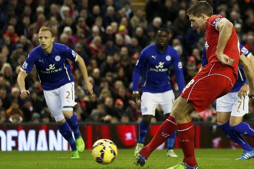 Liverpool's Steven Gerrard shoots to score a goal from a penalty during their English Premier League soccer match against Leicester City at Anfield in Liverpool, northern England Jan 1, 2015. -- PHOTO: REUTERS