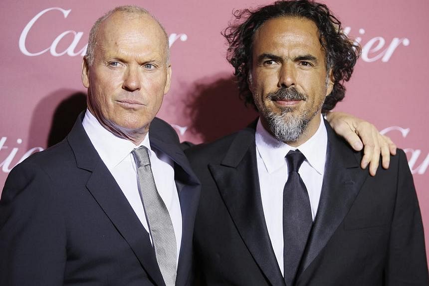 Birdman director Alejandro Gonzalez Inarritu (right) and the film's star Michael Keaton pose at the 26th Annual Palm Springs International Film Festival Awards Gala in Palm Springs, California on Saturday. -- PHOTO: REUTERS