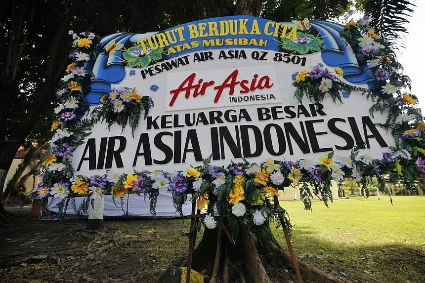 A wreath from AirAsia Indonesia to the victims of flight QZ8501 is seen at the Bhayangkara hospital in Surabaya's East Java Police headquarters on Jan 7, 2015. -- ST PHOTO: KEVIN LIM