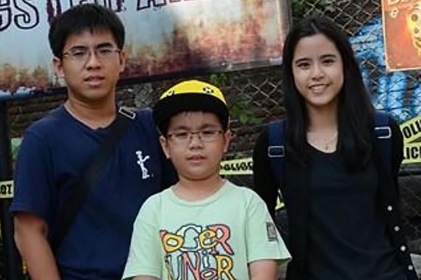 The body of Nico Giovanni (left), a St Andrew's Junior College student on board the ill-fated AirAsia flight QZ8501, was identified on Wednesday, Jan 7, 2015, Detik News reported. With him in this picture is his brother Justin (centre), who was on th