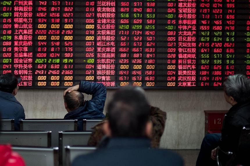China's stock market watchdog has approved the initial public offerings of 20 firms, it said late on Monday. -- PHOTO: AFP&nbsp;