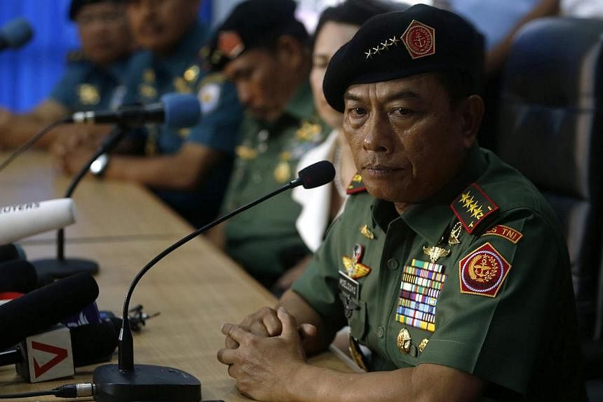 Indonesia's chief of armed forces, General Moeldoko, told reporters that he saw for himself that "the environment is not easy", but that "our men are working very hard and risking our lives". -- PHOTO: REUTERS