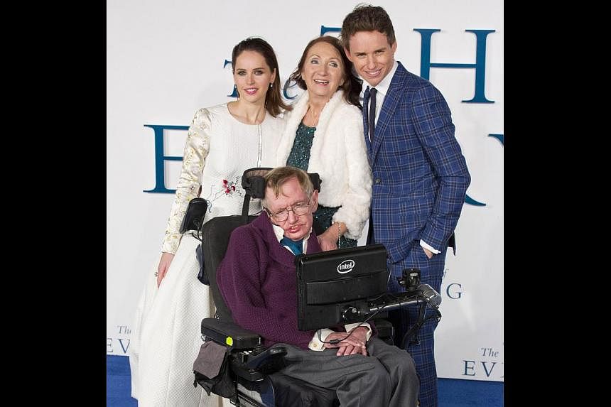 British scientist Stephen Hawking (front) at the UK premiere of The Theory Of Everything with (back row from left) actress Felicity Jones, his ex-wife Jane Wilde and the actor who plays him, Eddie Redmayne. -- PHOTO: AGENCE FRANCE-PRESSE