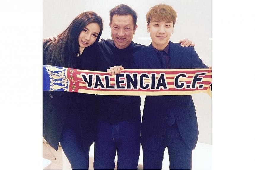Ms Kim Lim, her father Peter Lim and K-pop star Seungri of BigBang attend a Valencia CF match in Spain. -- PHOTO: SEUNGRI/ INSTAGRAM
