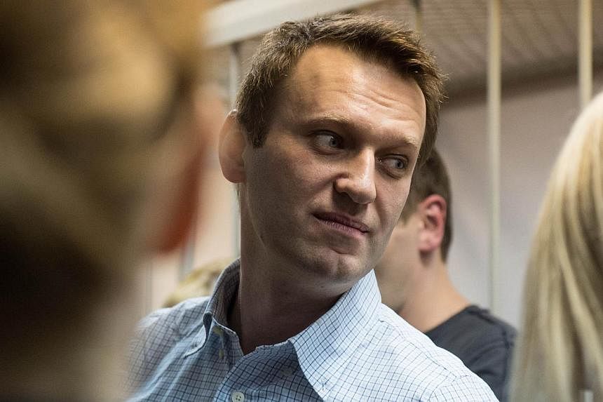 A Russian court on Tuesday refused to take legal action after top opposition leader Alexei Navalny (above) defiantly cut short his house arrest by snipping off his security bracelet. -- PHOTO: AFP