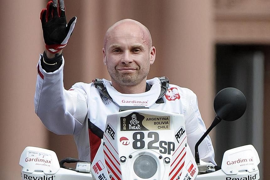 A Jan 3, 2015 photo of Polish biker Michal Hernik during the symbolic start of the 2015 Dakar Rally in Buenos Aires. Hernik died on Tuesday while racing in the gruelling event. -- PHOTO: AFP