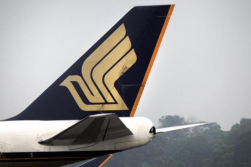 A Singapore Airlines flight preparing to take off from Changi Airport's Terminal 3 had to taxi back to the gates on Wednesday morning, after its pilots received a technical fault message. -- PHOTO: ST FILE