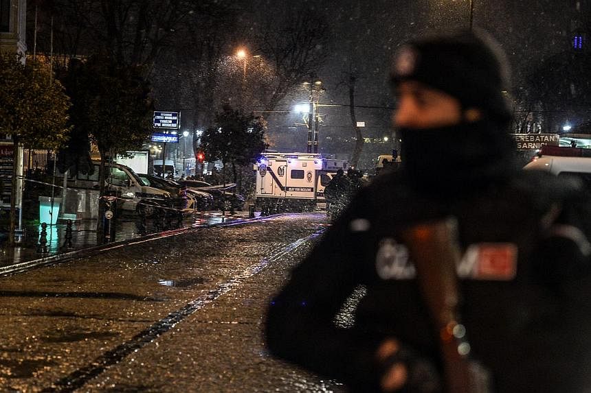 A police officer stands guard along a street leading to a police station where a female suicide bomber was killed on Jan 6, 2015.&nbsp;A female suicide bomber on Tuesday blew herself up in the most-visited tourist district of Istanbul, killing hersel