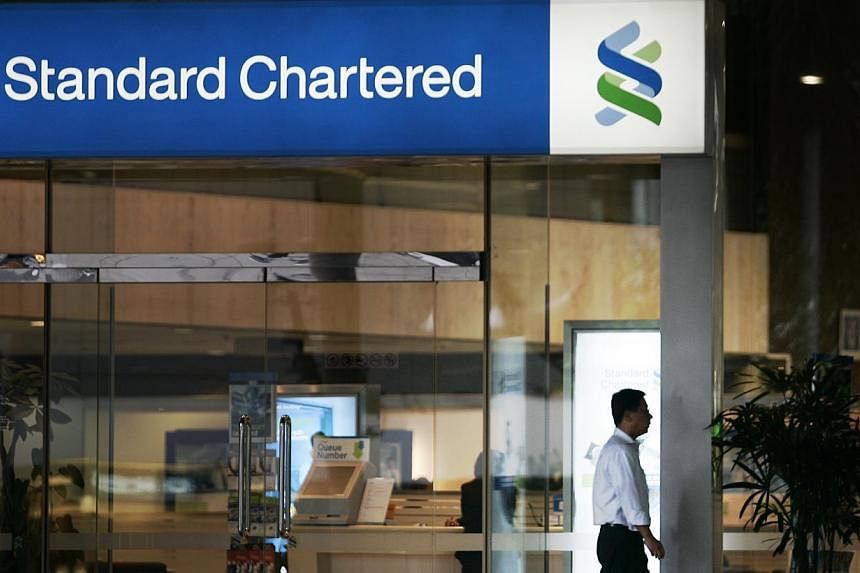 Standard Chartered last year said it would target more than US$400 million in cost cuts as it seeks to reverse a decline in its profit growth. -- PHOTO: ST FILE