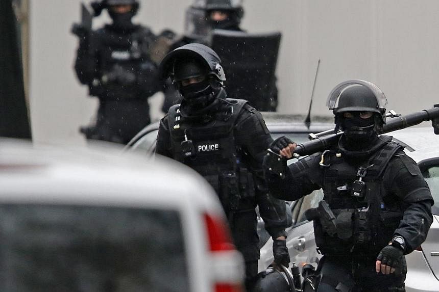 Members of French special police forces of Research and Intervention Brigade (BRI) are seen at the scene of a shooting in the street of Montrouge near Paris on Jan 8, 2015.&nbsp;Two armed suspects of a Paris magazine shooting have been cornered in a 
