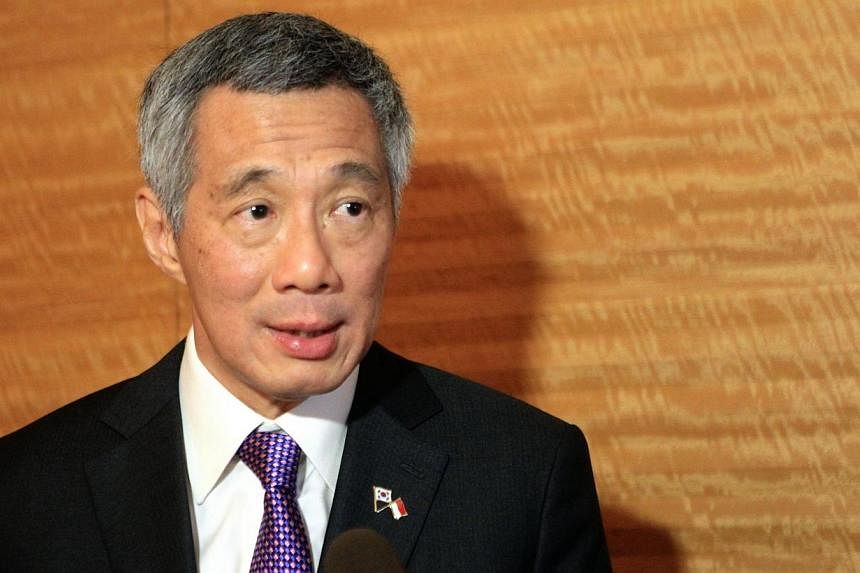 Singapore strongly condemns the deadly attack on French magazine Charlie Hebdo which killed 12 people, said Prime Minister Lee Hsien Loong. -- PHOTO: ZAOBAO