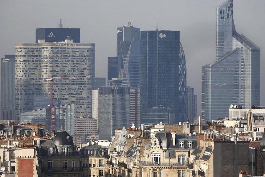 A view shows city rooftops of residential apartment buildings in Paris with the financial district of La Defense in the background on Dec 9, 2014.&nbsp;Workers in Paris's La Defense business district received an e-mail on Thursday morning warning the