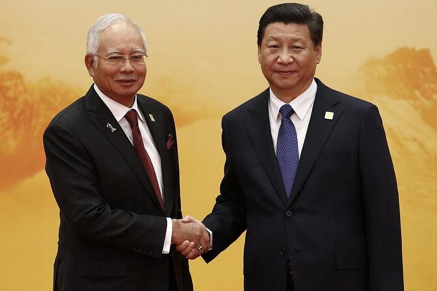 Malaysian Prime Minister Najib Razak with Chinese President Xi Jinping. Malaysia has maintained friendly relations with China, and as Asean chairman could facilitate progress in talks over disputes in the South China Sea. -- PHOTO: REUTERS