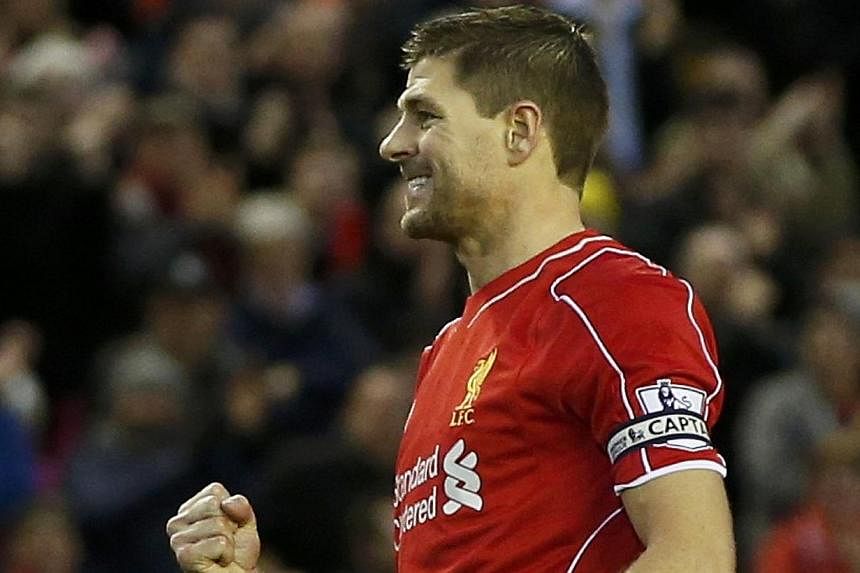 Liverpool's Steven Gerrard celebrates his goal after scoring a penalty during their English Premier League soccer match against Leicester City at Anfield in Liverpool, northern England Jan 1, 2015. The Los Angeles Galaxy confirmed on Wednesday that L