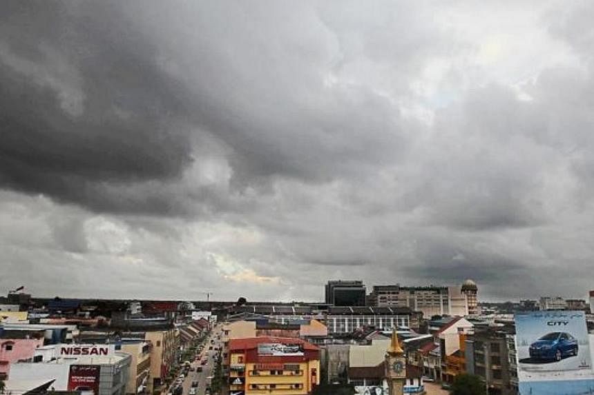 Black clouds hovering above Kota Baru town. -- PHOTO: THE STAR/ASIA NEWS NETWORK