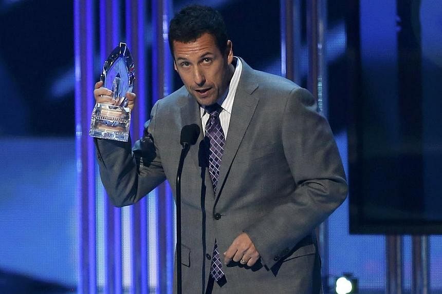 Adam Sandler accepting the award for favourite comedic movie actor. -- PHOTO: REUTERS &nbsp;