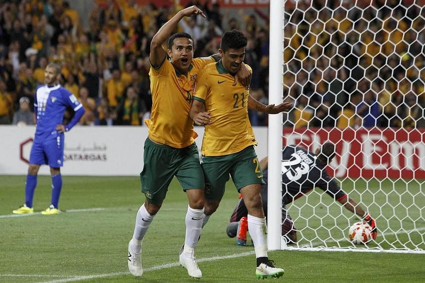 Australia's Massimo Luongo (right) celebrates his goal with teammate Tim Cahill during their Asian Cup Group A soccer match against Kuwait at the Rectangular stadium in Melbourne on Jan 9, 2015.&nbsp;Hosts Australia showed impressive firepower to bea