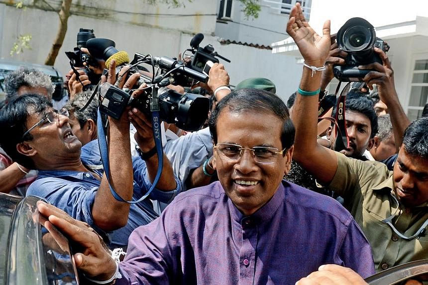 Sri Lanka's newly elected president Maithripala Sirisena leaves the opposition leader's office after meeting with political leaders who supported him, in the capital Colombo on Jan 9, 2015.&nbsp;-- PHOTO: AFP