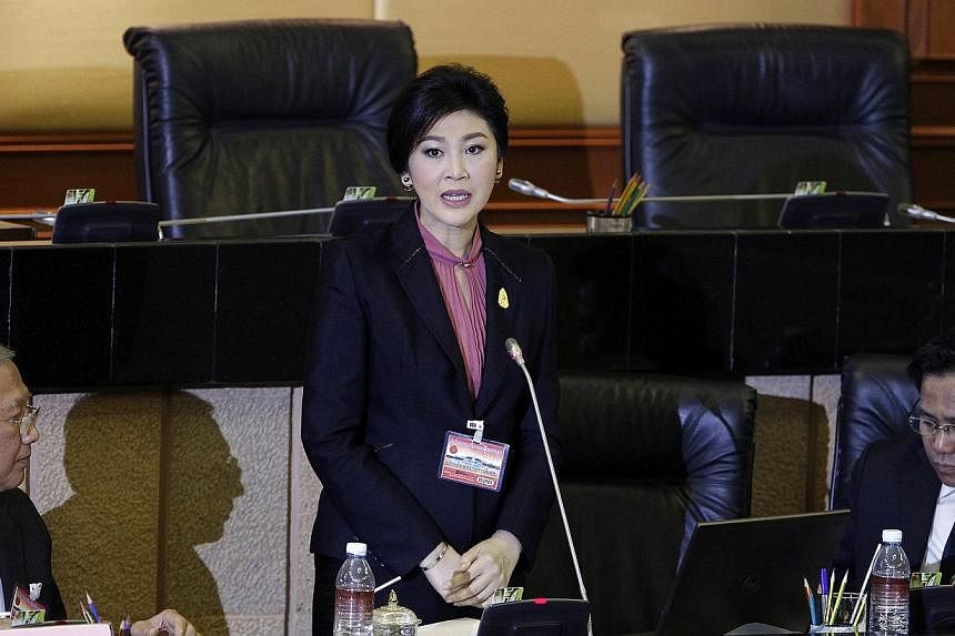 Ousted former Prime Minister Yingluck Shinawatra (centre) delivers her opening statement to the military-appointed National Legislative Assembly in Bangkok on Jan 9, 2015. Ms Yingluck denied all charges against her on Friday, at the start of impeachm
