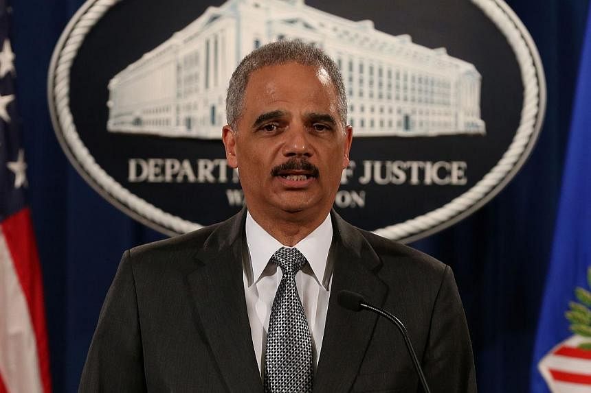 US Attorney-General Eric Holder (above) will attend international terror talks convened by France in Paris on Sunday after a deadly attack on a satirical newspaper, a Justice Department official said Thursday. -- PHOTO: AFP