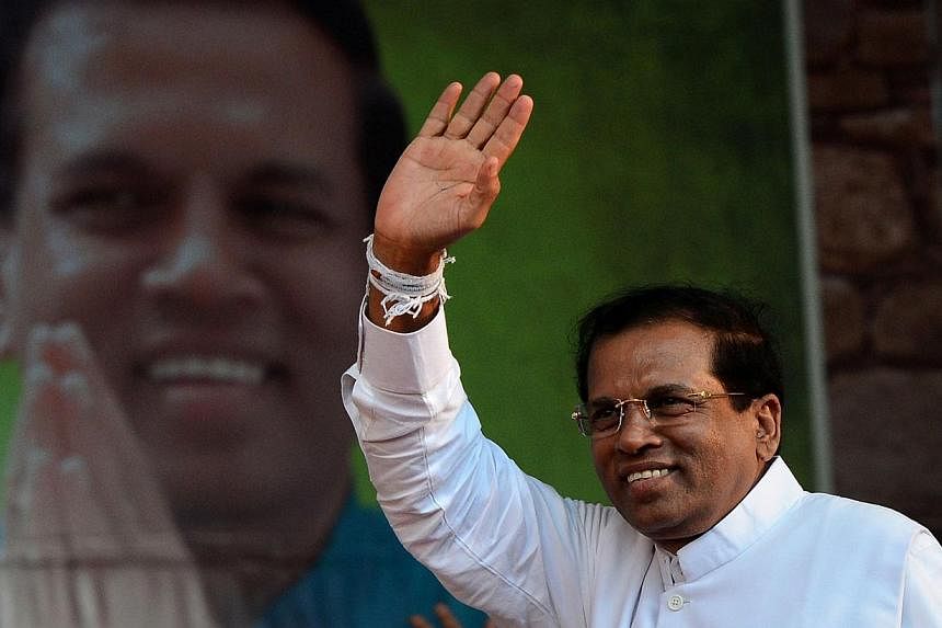 Sri Lanka’s main opposition candidate Maithri Sirisena (above) has taken an early lead over incumbent Mahinda Rajapakse in the island’s bitterly contested presidential election. --PHOTO: AFP