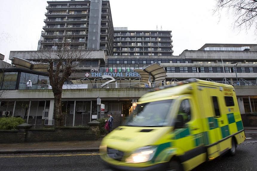 An ambulance pulls away from The Royal Free hospital in north London on Jan 3, 2015, where British nurse Pauline Cafferkey is still in a critical condition with Ebola, according to her family on Thursday. -- PHOTO: AFP&nbsp;