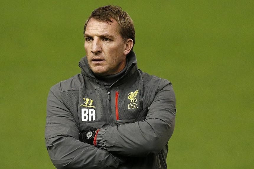 Steven's Gerrard's departure to LA Galaxy at the end of the season will leave a void at Liverpool but will open the door for others, manager Brendan Rodgers (above) said on Thursday. -- PHOTO: REUTERS