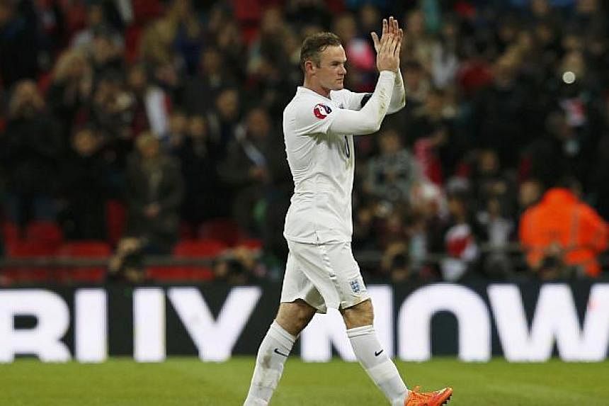 England captain Wayne Rooney (above) has been voted his national team's player of the year for 2014 after topping a supporters poll. -- PHOTO: REUTERS