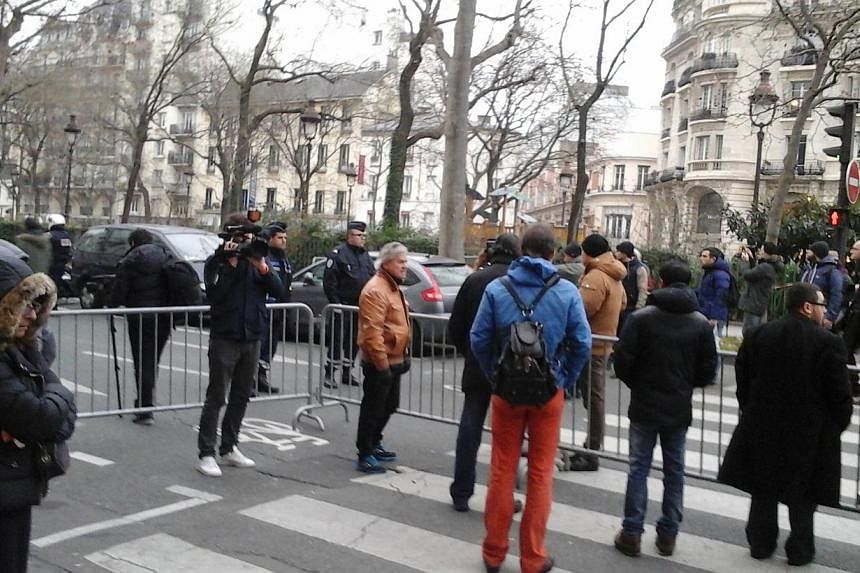 Singaporean Sheila Hassan visited the scene of the shootings at the Paris offices of satirical magazine Charlie Hebdo on Wednesday to pay her respects. -- PHOTO:&nbsp;SHEILA HASSAN