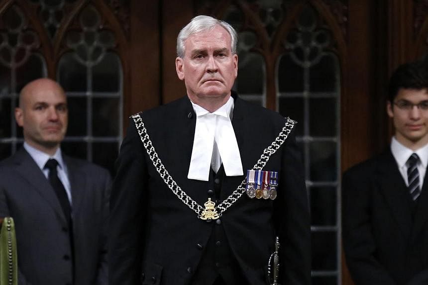 Canada's Sergeant-at-Arms Kevin Vickers is applauded in the House of Commons in Ottawa, in this file photo taken Oct 23, 2014. He&nbsp;will be named ambassador to Ireland, the government announced on Thursday. -- PHOTO: REUTERS