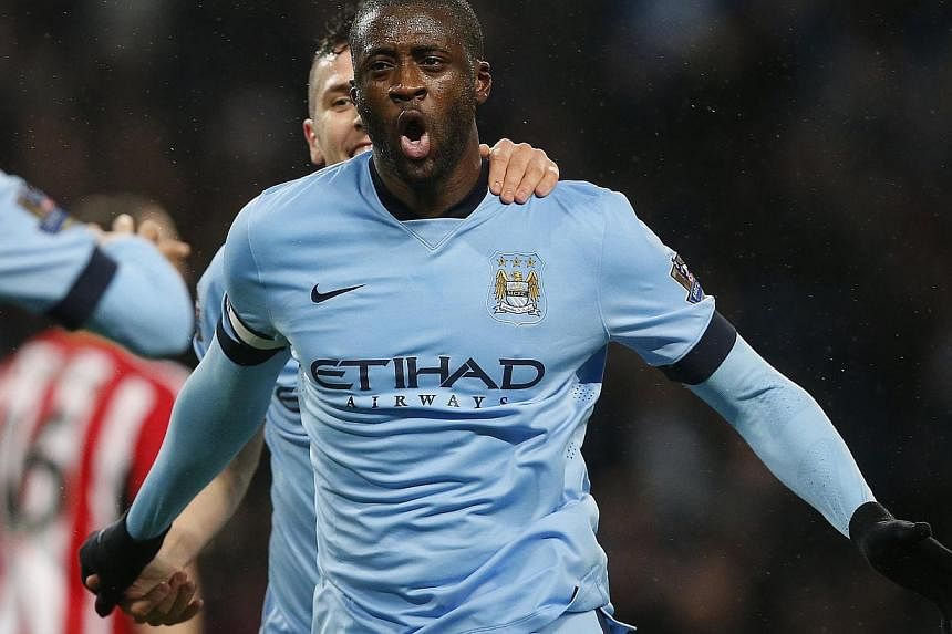 Manchester City's Yaya Toure celebrates after scoring the opening goal during their English Premier League soccer match against Sunderland at the Etihad Stadium in Manchester, northern England January 1, 2015. -- PHOTO: REUTERS