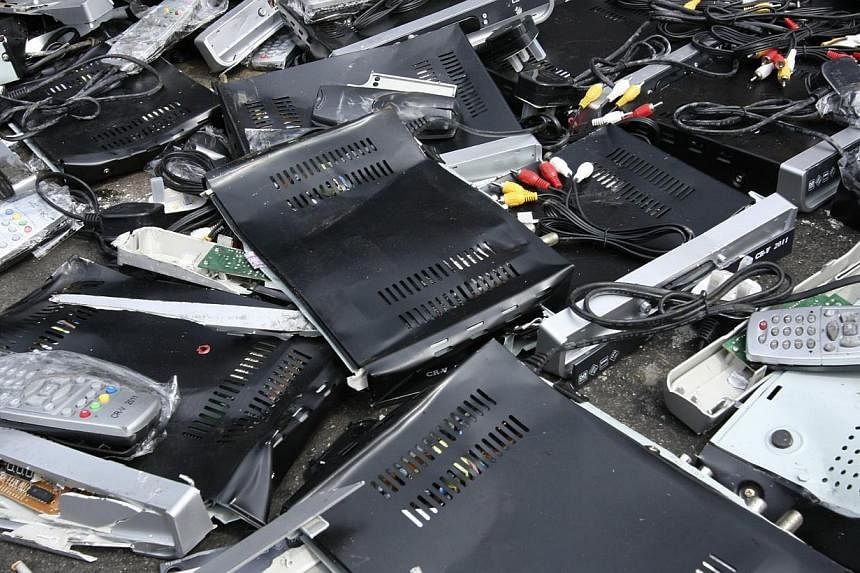 Illegal cable TV set-top boxes that have been crushed. -- PHOTO: STARHUB