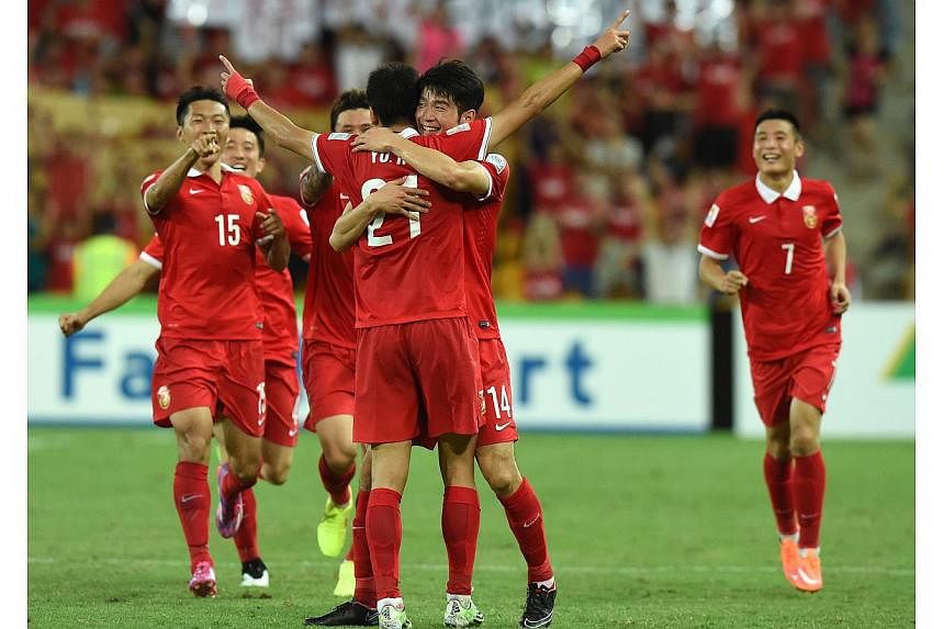 China's Yu Hai (centre) reacts after scoring a second half goal during the Group B Asian Cup match between the Kingdom of Saudi Arabia and the People's Republic of China at Brisbane Stadium in Brisbane, Australia on Saturday, Jan 10, 2015. -- PHOTO: 