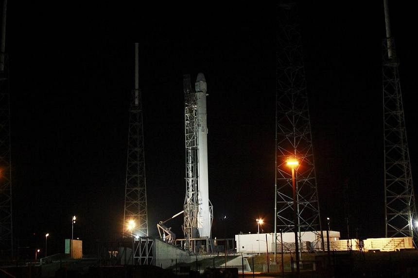 The unmanned SpaceX Falcon 9 rocket sits on the launch pad at Cape Canaveral Air Force Station, Florida Jan 9, 2015, a few hours before the scheduled 4:47am (0947 GMT) launch. The rocket has a cargo resupply mission to the International Space Station