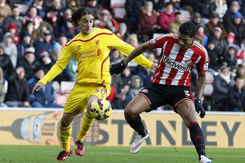 Liverpool's Lazar Markovic (left) scores the opening goal during the English Premier League soccer match between against Sunderland AFC and Liverpool FC at the Stadium of Light in Sunderland, Britain, on Jan 10, 2015. -- PHOTO: EPA