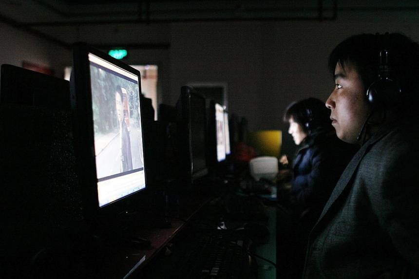 A man uses a computer inside an Internet cafe in Shanghai. China deleted more than three million pieces of pornographic content from the Internet in 2014, state media reported Saturday, as part of a campaign to cleanse the country's online sphere.&nb