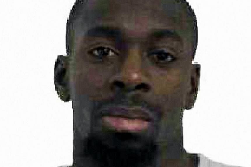 The gunman killed by police on Friday after taking hostages at a Jewish supermarket in Paris - Amedy Coulibaly (above)&nbsp;- told BFMTV station he had "coordinated" with the suspected Charlie Hebdo attackers and belonged to the Islamic State group. 