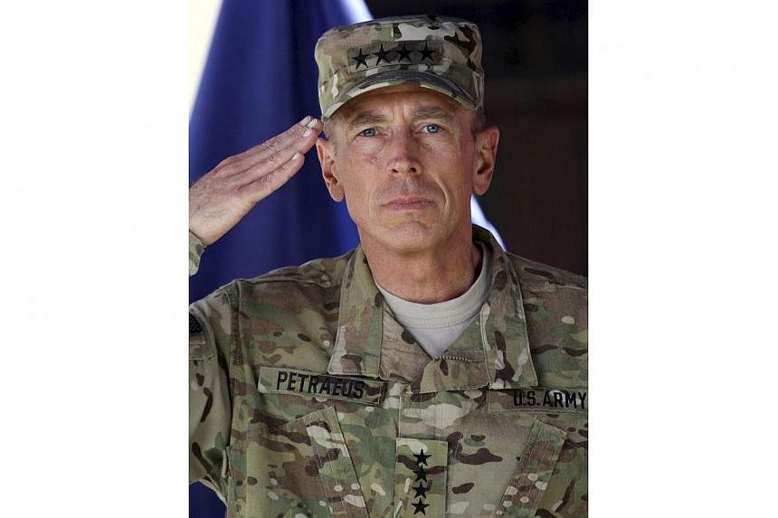 The US investigation stems from an affair retired general David Petraeus (seen here in a 2011 photo) had with an army reserve officer who was writing his biography. -- PHOTO: EPA