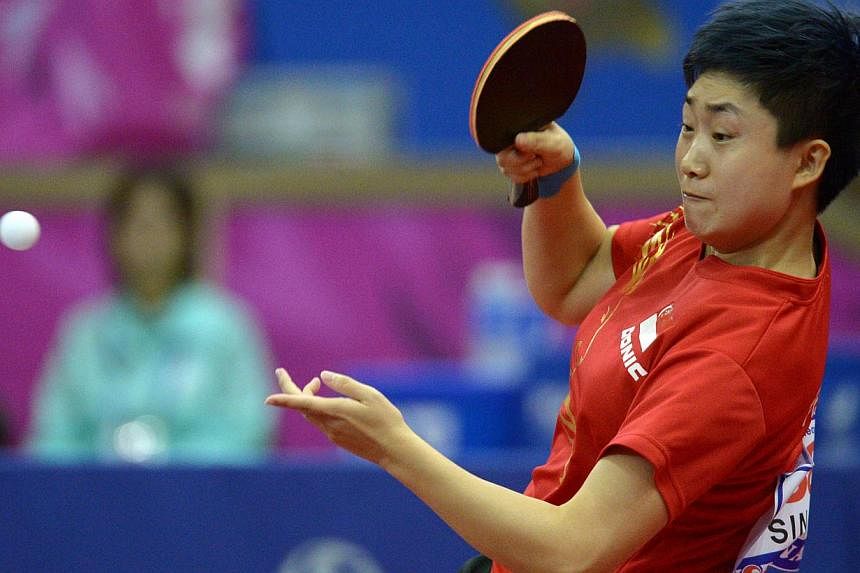 Singapore's Feng Tianwei in action against China's Zhu Yuling in the table tennis women's semi finals during the 2014 Asian Games at the Suwon Gymnasium in Incheon on Oct 4, 2014. -- PHOTO:&nbsp;DESMOND WEE