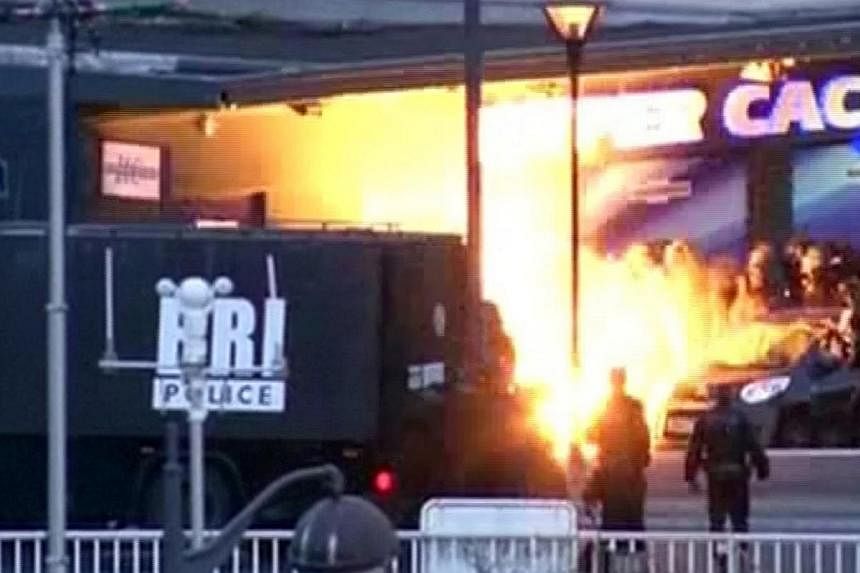 A still image from video shows an explosion lighting the front of a kosher supermarket as French police special forces launch their assault, where several people were taken hostage near the Porte de Vincennes in eastern Paris Jan 9, 2015. -- PHOTO: R