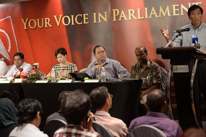 Singapore Democratic Party (SDP) secretary-general Chee Soon Juan (right) speaks during the SDP GE2015 Campaign Kick-off while party member Bryan Lim (from left), party member James Gomez, assistant treasurer Jaslyn Go, vice chairman John Tan and par