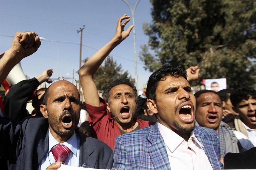 Protesters shout slogans during a demonstration against a car bomb attack that killed 35 people and wounded dozens, in Sanaa Jan 10, 2015.&nbsp;Hundreds of Yemenis took to the streets of Sanaa on Saturday to protest attacks by Al-Qaeda, including a b
