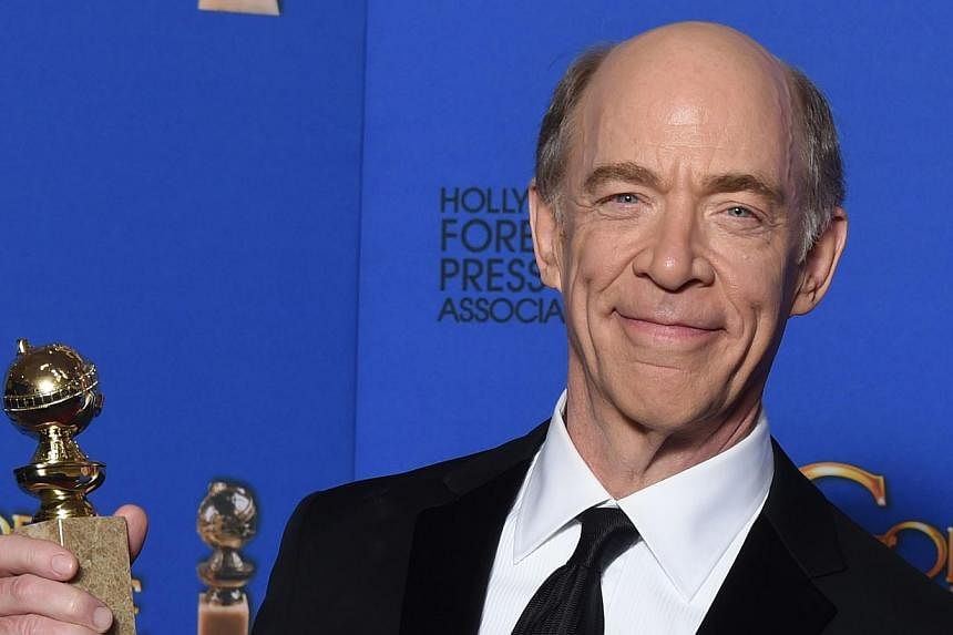J.K. Simmons won the first award handed out at the Golden Globes on Sunday, the best supporting film actor prize for his turn as a brutal music teacher in Whiplash. -- PHOTO: AFP