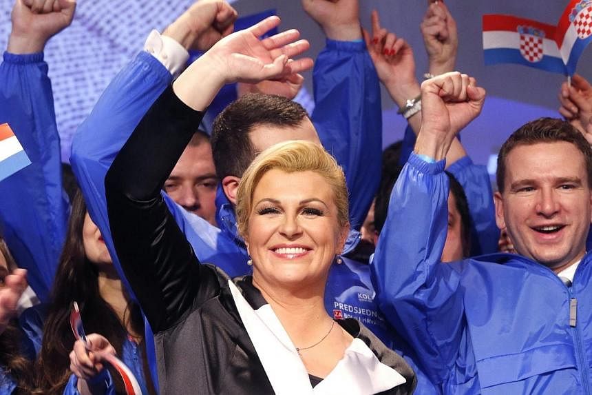 Kolinda Grabar-Kitarovic celebrates her victory against Ivo Josipovic in the presidential elections in Zagreb, Croatia, on Jan 11, 2015.&nbsp;Conservative Kolinda Grabar-Kitarovic was elected Croatia's first female president on Sunday, narrowly winni
