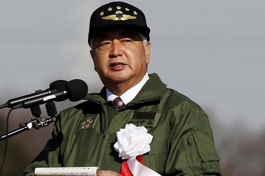 Japan's Defence Minister Gen Nakatani speaks during an annual new year military exercise by the Japanese Ground Self-Defense Force 1st Airborne Brigade at Narashino exercise field in Funabashi, east of Tokyo on Jan 11, 2015. -- PHOTO: REUTERS